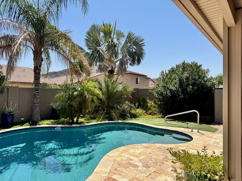 Backyard Oasis with Customized Pool and Lush Landscape image